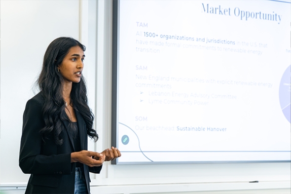 Math and Economics double-major Nina Raju '29 shares findings during her team's final presentation.