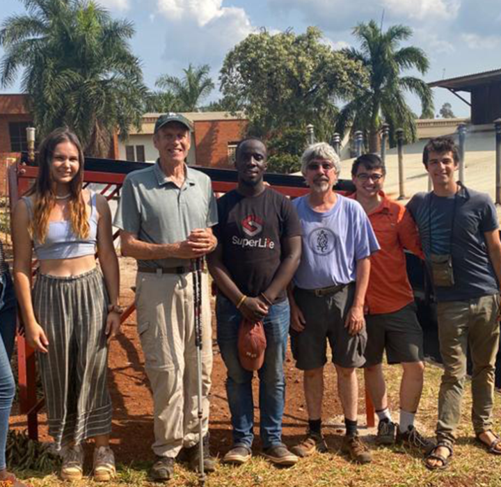 A group of people standing near a work site