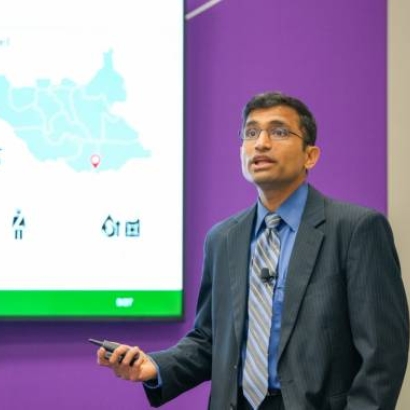 Dartmouth Professor Vikrant Vaze delivers a presentation.