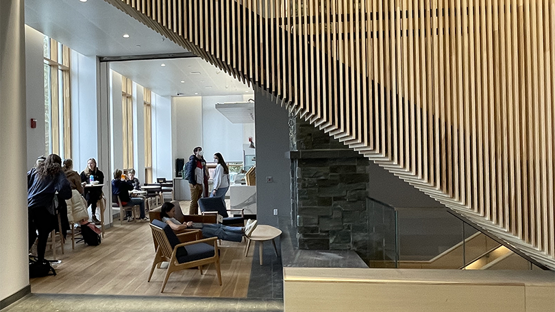 An image of wood slats looking into the lounge and cafe space