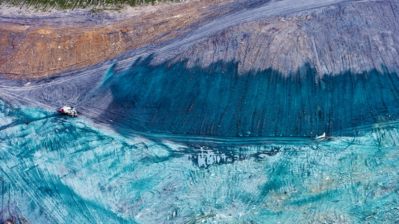 An image of a truck hydroseeding a former mine site