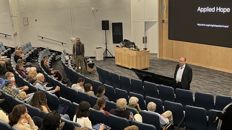 Amory Lovins speaking to a group of people in an auditorium