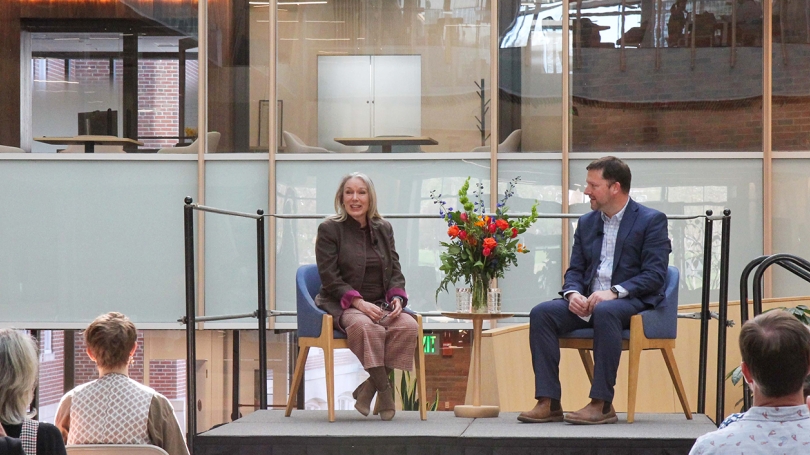 Miranda Ballentine and Derek Walker in the Irving Institute Atrium. Miranda Ballentine and Derek Walker on a small stage in the Irving Institute Atrium.
