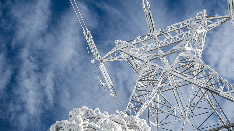Electric transmission tower in the snow