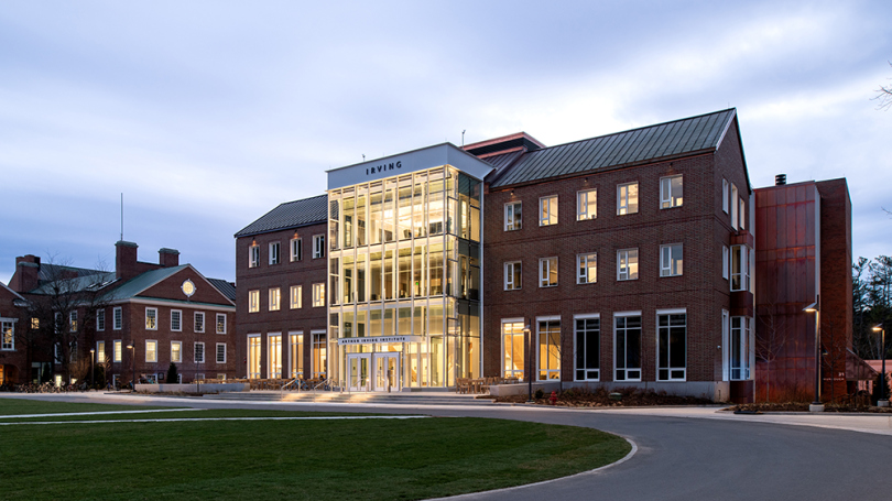 An exterior view of the Irving Institute with Thayer to the left and green grass in the front