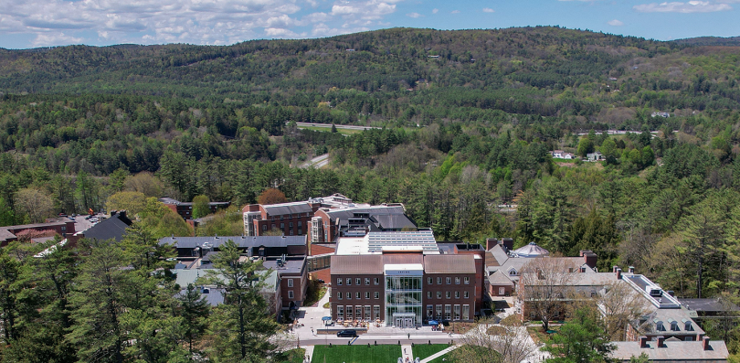 Aerial view of the Irving Institute building with trees and mountains 