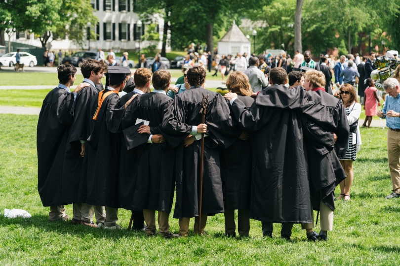 Dartmouth students stand in the Green for photos after Commencement